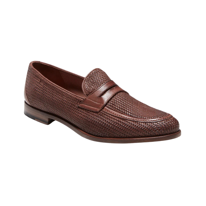 Sophisticated leather penny loafer. The shoe is finely woven and colored with a finished upper, a process that enhances its craftsmanship. The leather sole is hand-colored and wax-polished in the same color as the upper.