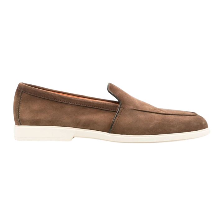 Cedar brown. Calf suede. Tonal stitching. Almond toe. Branded leather insole. Flat rubber sole. Slip-on style. Made in Italy.