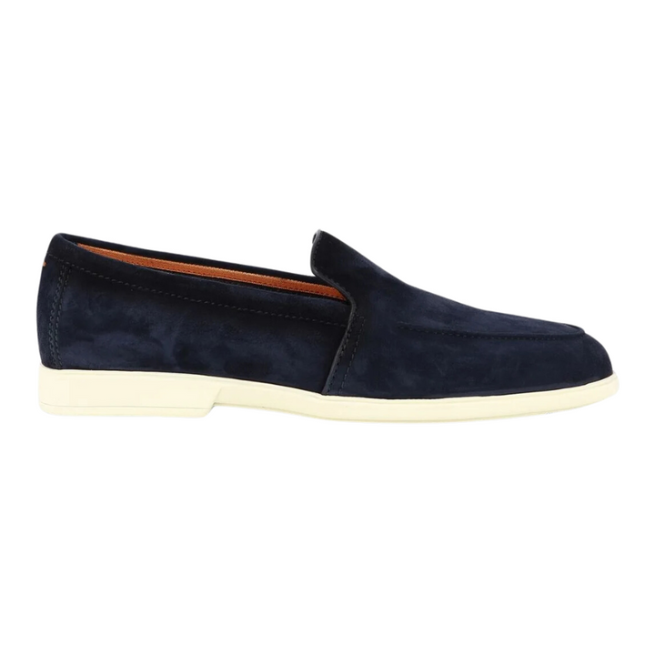 Calf suede. Tonal stitching. Almond toe. Branded leather insole. Flat rubber sole. Slip-on style. Made in Italy.