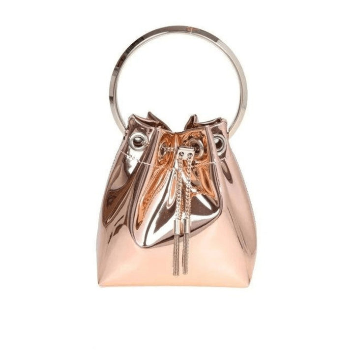 Shining and statement, the iconic Bon Bon handbag is crafted from silver mirror fabric. Made in Italy, Jimmy Choo's signature style features a chain drawstring fastening with tassels and is finished with a metal bracelet top handle. Carry in hand or drape cross-body using the chain strap. Mirror fabric. Metal top handle. Chain drawstring closure. Chain strap. Interior pocket. Tassel detailing. Bag measures: L14 x H15 x W9.5cm. Strap measures: 55cm. Handle drop measures: 9cm. Made in Italy.