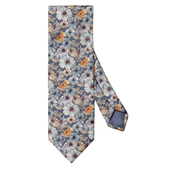 An elegant tie woven from 100% pure silk crafted with a micro floral pattern with a rich texture and impeccable luster. The ideal addition to classic business wear. Made in Italy.