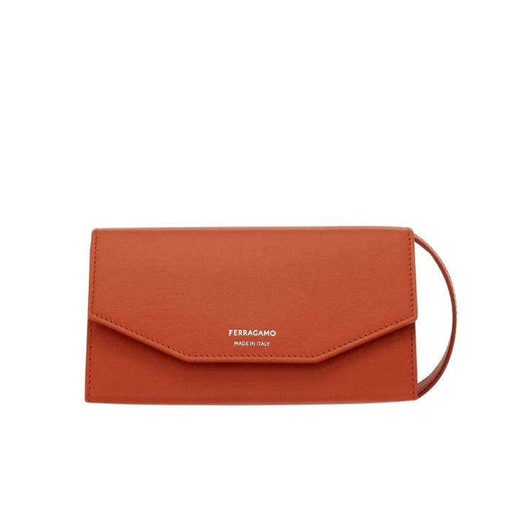 The geometric design and small size make this new Ferragamo crossbody bag a hugely fashionable accessory. Crafted from smooth calfskin, it opens with a semi-rigid flap and features a lined interior with card and document slots. The adjustable and detachable strap means you can carry it as a shoulder bag or by hand as a clutch. height 9.0 CM / 3.5 IN length 18.0 CM / 7 IN width 9.0 CM / 3.5 IN. Composition: calfskin. Made in ITALY.