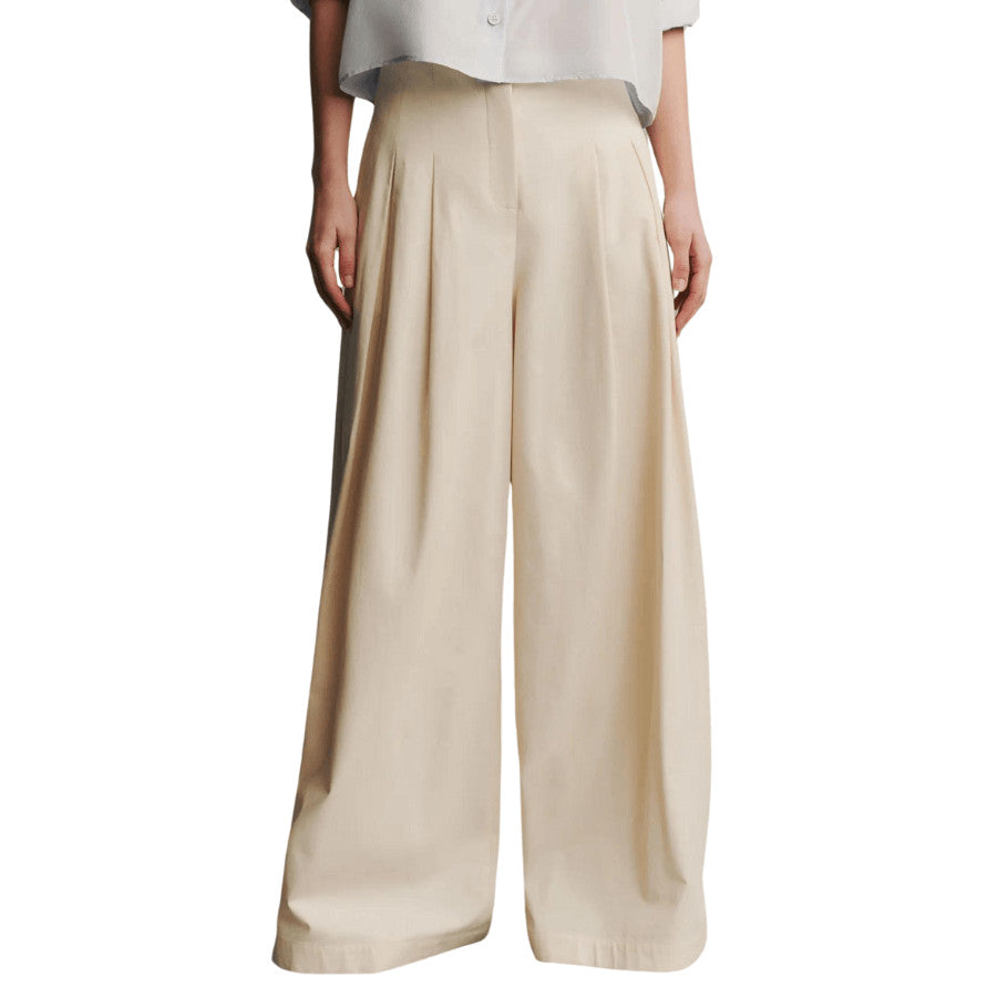 TWP’s signature high-rise, pleated floor-length pants crafted in soft, lightweight cotton gabardine. The Drew features elegant pleats, creating a dynamic silhouette. Complete with side pockets, a zip-fly and a hook fastening at the waistband.