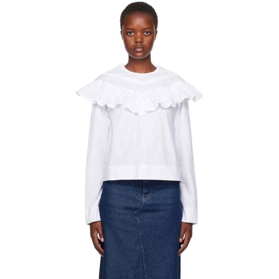 Organic cotton poplin blouse. Ruffled trim throughout.