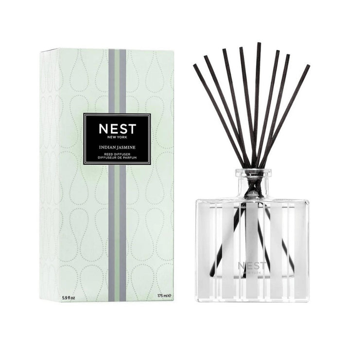 Immerse yourself in the lush jasmine fields of India with this Reed Diffuser featuring an intense jasmine absolute surrounded by bright red berries, sparkling bergamot, and spicy pink pepper. Housed in a glass vessel etched with elegant, frosted stripes and includes 8 all-natural rattan reed sticks. 5.9 fl oz | 175 ml. Expertly crafted with the highest quality fragrance oils, this Reed Diffuser releases an exquisite scent slowly and evenly into the air for approximately 90 days, delivering continuous fragra