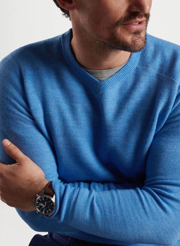 This lightweight sweater is crafted from the softest 17.5 micron Merino wool with an intricate honeycomb stitch. A unique high-V construction sits between a traditional V-neck and crewneck for an updated take on timeless style.