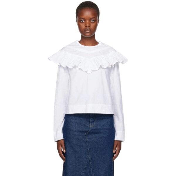 Organic cotton poplin blouse. Ruffled trim throughout.
