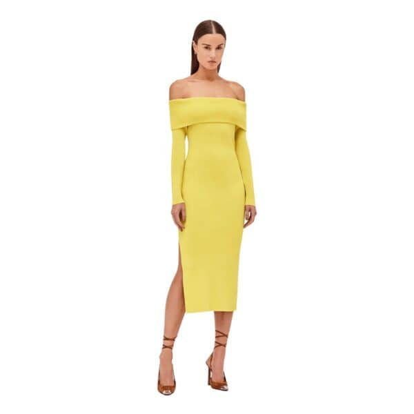 The Justine Dress features a ribbed stretch fabric and fold-over detail, creating a chic yet comfortable look. Its side slit and midi length add a modern touch, while its ease of wear makes it the perfect go-to dress.