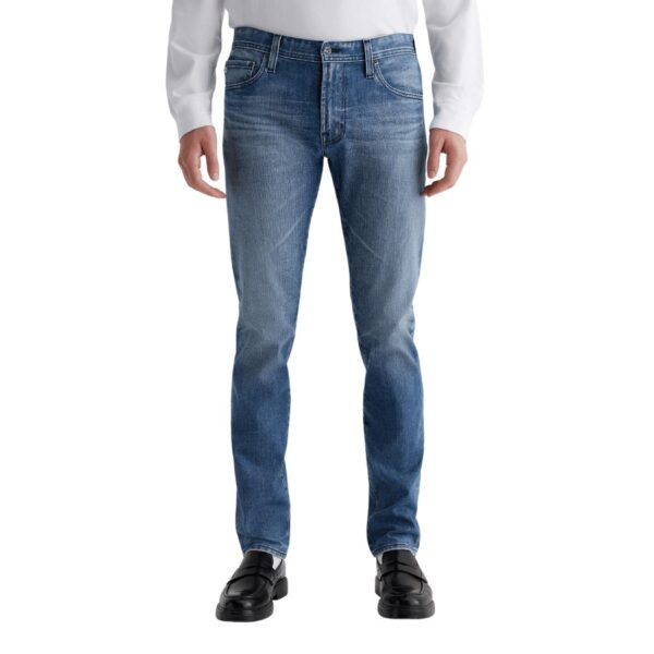 The Tellis is our modern slim fit for men, updated in an AG-ed™ light blue wash with a 17-year vintage fade. These five-pocket jeans feature a fitted upper block and a tapered leg opening. Cut from 11 oz. Flex 360° Denim, the pair has all-direction stretch for supreme comfort and ease of movement.