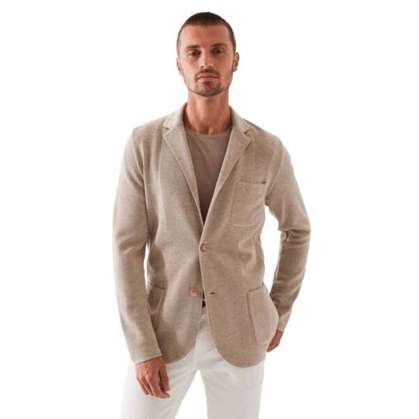 100% Merino Wool. Two-Button. Front Patch Pockets. Dry Clean Only. Made in Italy.