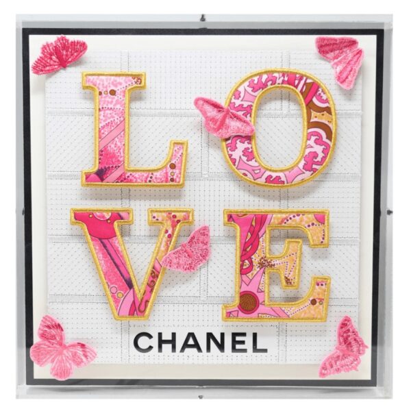 The Love pieces start with a background created from luxury boxes and bags that have been deconstructed and then directly embroidered. The typography is created using a luxury brand silk scarf that is embroidered, appliquéd, and then mounted in relief to the background. The butterflies are all individually embroidered to harmoniously blend with the scarf colors and are mounted in relief for a dimensional effect. 12" x 12" x 2" in size. The art comes framed in acrylic and is signed and numbered by the artist.