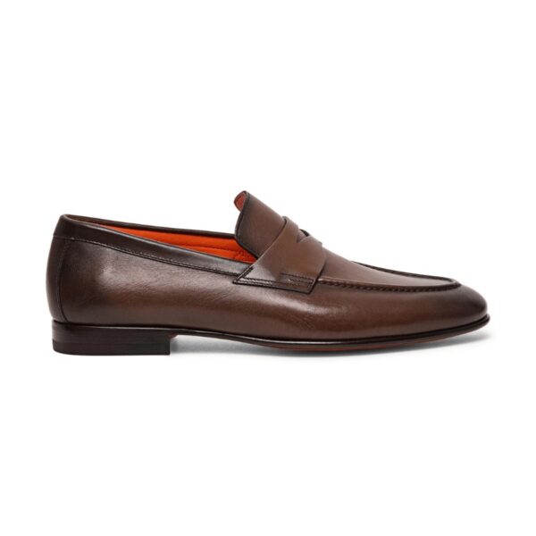 Crafted from hand-polished leather. Classic silhouette with regular fit and round toe. Raised apron stitching. Saddle strap. Orange leather lining. Leather sole with half rubber heel.