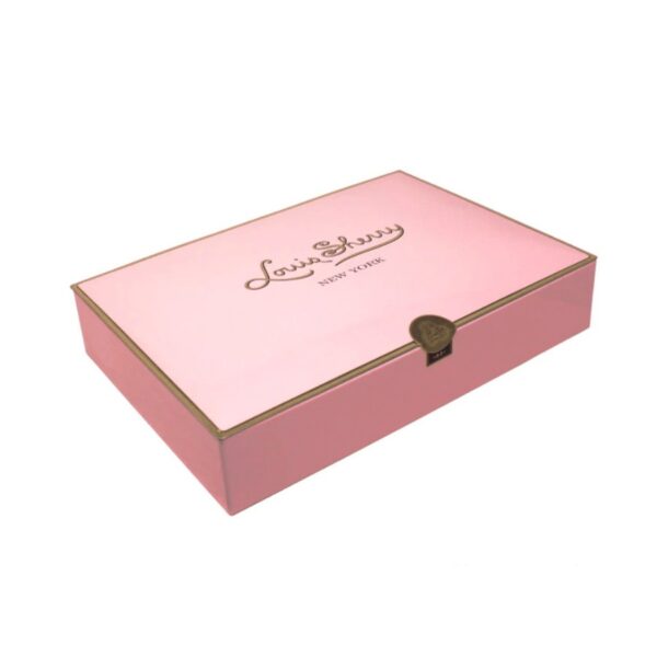 The Grand Dame of Louis Sherry. This luxury gift box features an exquisite selection of 24 truffles and Louis Sherry signature trefoils.  A presentation unrivaled - it is an expression of the highest compliments that can be conveyed in a gift of confectionery.  Available in Camellia Pink, Carnival Chinois, Magnolia, Orchid, Nile Blue, Vreeland Red,  and our original 1881 Gold.  A timeless gift that is sure to impress young and old alike.