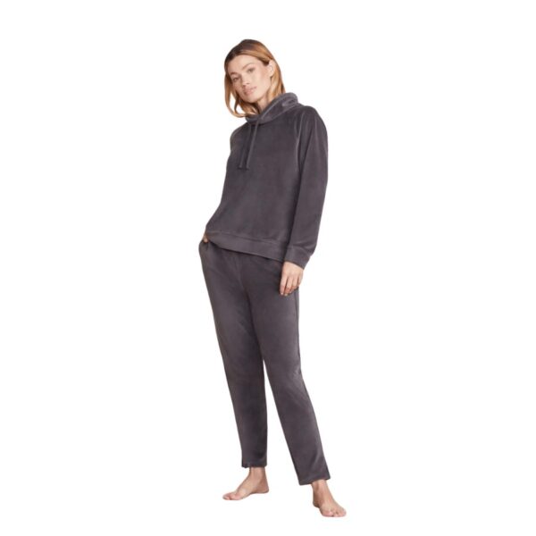 From Barefoot Dreams Day to Night Collection ™, crafted from a soft, luxurious fabric, the pullover features a funnel neck, raglan style and drawcords at the neckline for a custom fit. The split hi-lo hemline adds stylish detailing, while it sits just below the hip in the back for optimum coverage. Makes a complete set when paired with Barefoot Dreams LuxeChic Skinny Pant with Zippers.  Model is 5′ 7″ and is wearing a size S. 95% Polyester, 5% Spandex. Machine wash cold in the gentle cycle. Lay flat to dry or tumble dry low. Steam or cool iron if necessary. For best care, do not use bleach, dryer sheets, or fabric softener.