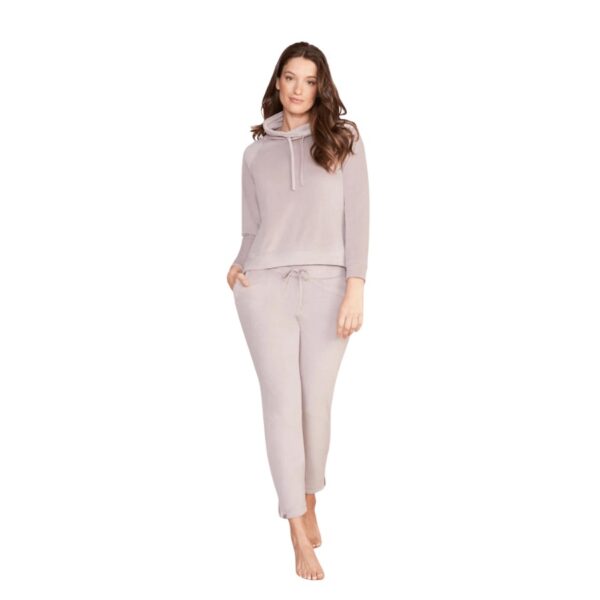 These pants will give you a sleek and stylish look with a skinny leg silhouette and ultra-flattering forward seam detail. Keep warm and snuggly with its soft elasticated waistband and drawcord. For a fashionable touch, these pants feature hidden invisible zips in the side seams. Makes a complete set when paired with Barefoot Dreams LuxeChic Funnel Neck Pullover. Models are 5' 7" and 5'10" and wearing a size S. Inseam Length: 27.5". 95% Polyester and 5% Spandex. Machine wash cold in the gentle cycle. Lay flat to dry or tumble dry low. Steam or cool iron if necessary. For best care, do not use bleach, dryer sheets, or fabric softener.