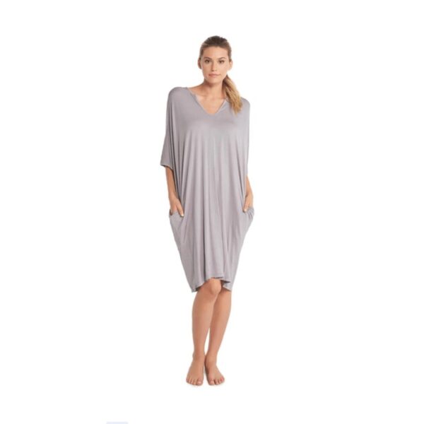 Be at ease in Barefoot Dreams versatile, knee-length short caftan.  The roomy fit with side pockets and dolman sleeves gives you an effortless look for leisure at home or around town. 67% Modal, 28% Acrylic from milk, 5% Spandex. Machine wash cold with mild detergent. Gentle cycle. Do not use bleach or fabric softener. Flat Dry recommended. If needed, tumble dry on Air Fluff or lowest dryer setting, with no dryer sheets. Cool iron or steam, if necessary.