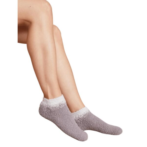 Barefoot Dreams CozyChic® Aspen Ankle Socks are the perfect accessory for any wardrobe. Crafted with a comfortable speckled cotton blend, the ankle length socks feature a gradient contrast color at the opening for an added touch of style, perfect for all-day wear. 97& Polyester and 3% Spandex. Machine wash cold in the gentle cycle. Lay flat to dry or tumble dry low. Steam or cool iron if necessary. For best care, do not use bleach, dryer sheets, or fabric softener.