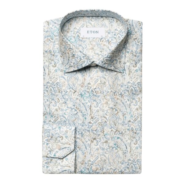 A contemporary dress shirt with a delicately detailed paisley print crafted from our luxury Cotton & TENCEL™ Lyocell fabric with outstanding softness, and a silky drape. This elegant staple is finished with standard buttons. Cotton & TENCEL™ Lyocell. Standard Buttons. 60% Cotton, 40% Lyocell.