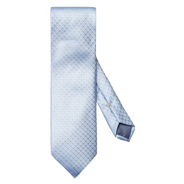 An elegant tie woven from 100% pure silk crafted with a micro floral pattern with a rich texture and impeccable luster. The ideal addition to classic business wear. Made in Italy.