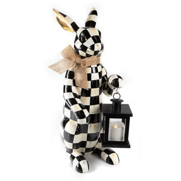 Let the Courtly Check Lantern Bunny light the way. Full of fun, this bunny, decorated in hand-painted Courtly Checks, holds a lantern that lights with batteries. 6" wide, 8.75" long, 20.5" tall. Resin. Pieces may vary due to the handmade nature of each product. Imported.