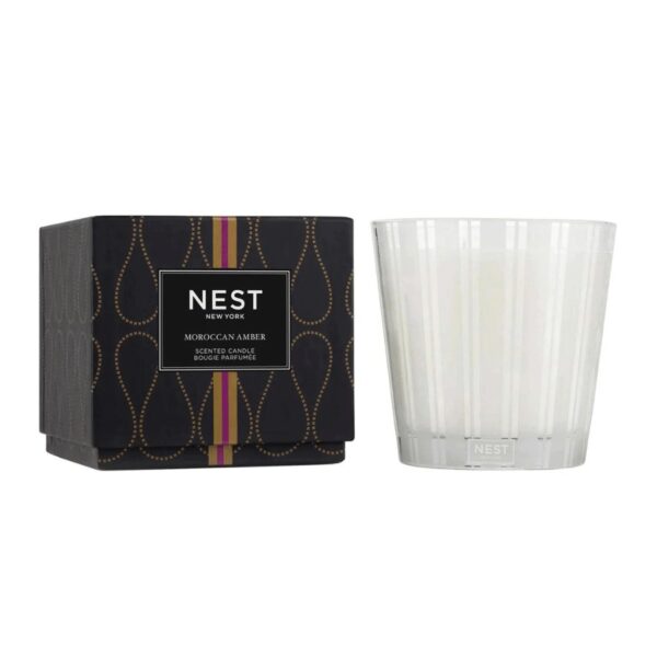 Create an exotic atmosphere with this 3-Wick Candle featuring Moroccan amber, sweet patchouli, heliotrope, and bergamot with a hint of eucalyptus. Housed in a glass vessel etched with elegant, frosted stripes to complement any decor. 21.2 oz | 600 g. This exquisitely fragranced candle is meticulously crafted with a proprietary premium wax formulated so the candle burns cleanly and evenly and infuses a room with exceptional scent.