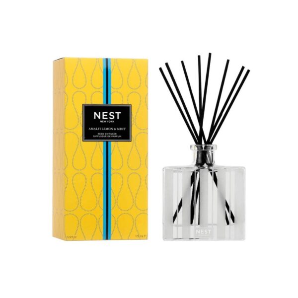 Evoke the essence of Italy’s Amalfi Coast with this Reed Diffuser featuring zesty lemon and orange bergamot blended with fresh mint and a hint of driftwood.  5.9 fl oz | 175 ml. Expertly crafted with the highest quality fragrance oils, this Reed Diffuser releases an exquisite scent slowly and evenly into the air for approximately 90 days, delivering continuous fragrance, uninterrupted. Housed in a glass vessel etched with elegant, frosted stripes and includes 8 all-natural rattan reed sticks.