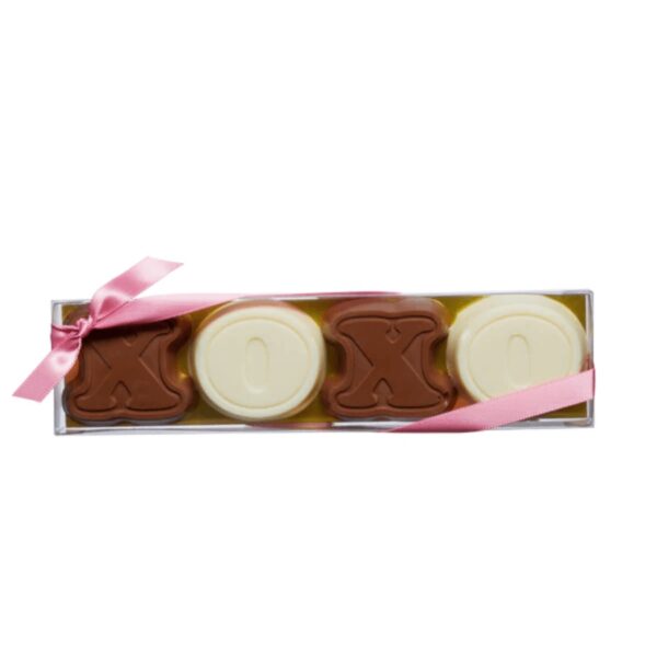 Send your message through these love notes. This novelty box includes a mix of solid milk and white chocolates in the shape of Xs and Os. The clear box is finished with a pink satin ribbon. 90g / 3.2oz. 12 per case. Shelf life - 12 months.