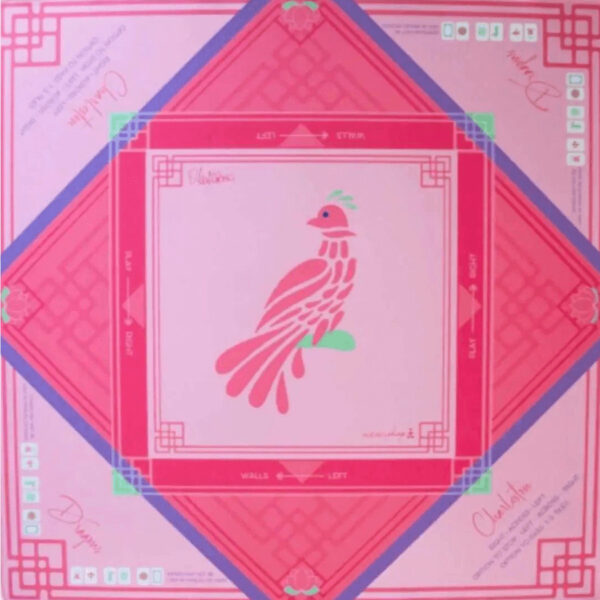 Introducing the fabulous and functional Bird Bam Neoprene American Mahjong mat! With a non-slip surface, it keeps your tiles in place while you play like a pro, thanks to the included basic rules. 33″ x 33″ with pink hem around edges. To eliminate creases in a mat, launder it in hot water and tumble dry on a high heat setting. Mat comes rolled with canvas bag.