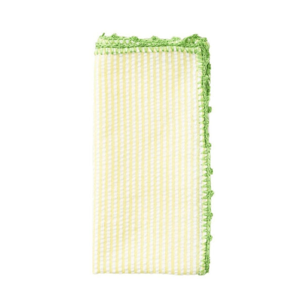 The 100% cotton napkin has a naturally wrinkled look (just like traditional seersucker fabric) and features a hand-crocheted border. The green edge contrasts nicely with the lighter yellow hue of the napkin. This is a best-selling style and is available in various color combinations to complement different dining moods. 21" Length x 21" Width.