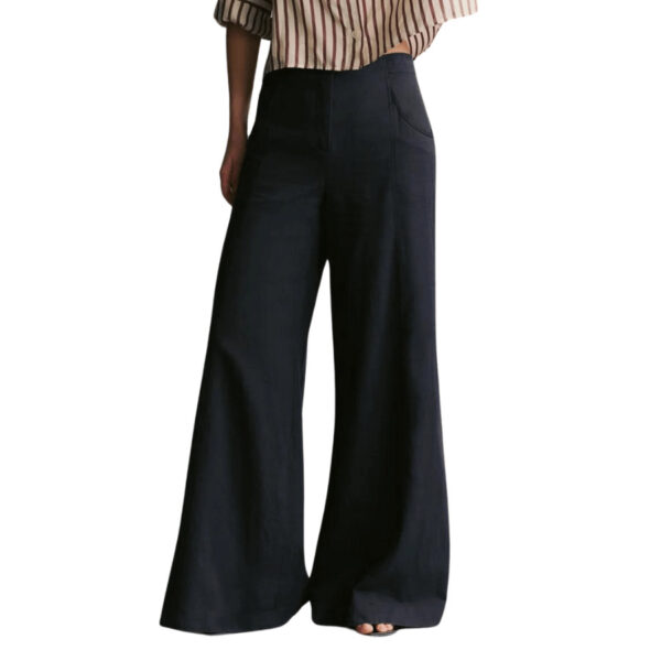 TWP’s signature high-rise, floor length, wide leg pant, crafted in ultra-soft, lightweight, linen cotton. The Demie is fitted at the hip and flares out into a dramatic wide leg. Complete with a zip-fly, hook and bar fastening, and side pockets.