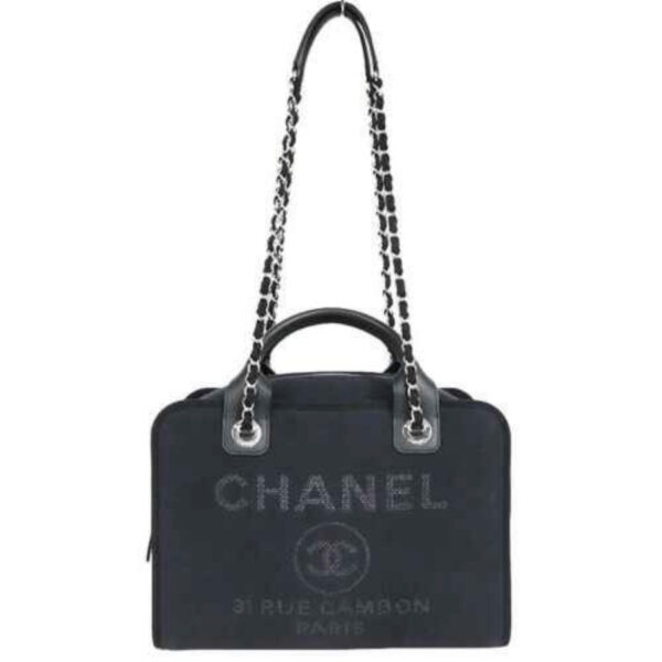 Chanel canvas bag in navy. Material: Canvas. Color: Navy. Style: Deauville Bowling. Country of Origin: Italy.