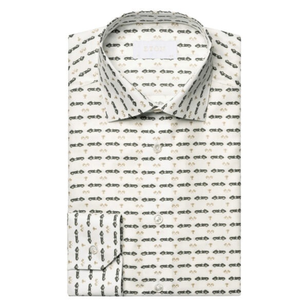 This sophisticated dress shirt is made from a luxurious 100% cotton Signature Twill fabric, known for its softness and subtle sheen. Its design showcases a vintage race car motif print accented with golden highlights, sourced from the print archive of Italian stationer Rossi 1931. Adorned with mother-of-pearl buttons and boasting 2 mm stitching on the collar and cuffs, it ensures a flawless drape and sharp look throughout the day. 100% Cotton.  Mother Of Pearl Buttons. Wrinkle Free.